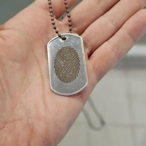 Fingerprint laser engraving on silver pendant