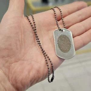 Fingerprint laser engraving on silver pendant